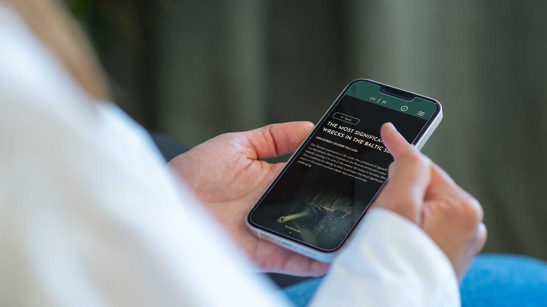 Person browsing the exhibition on their phone