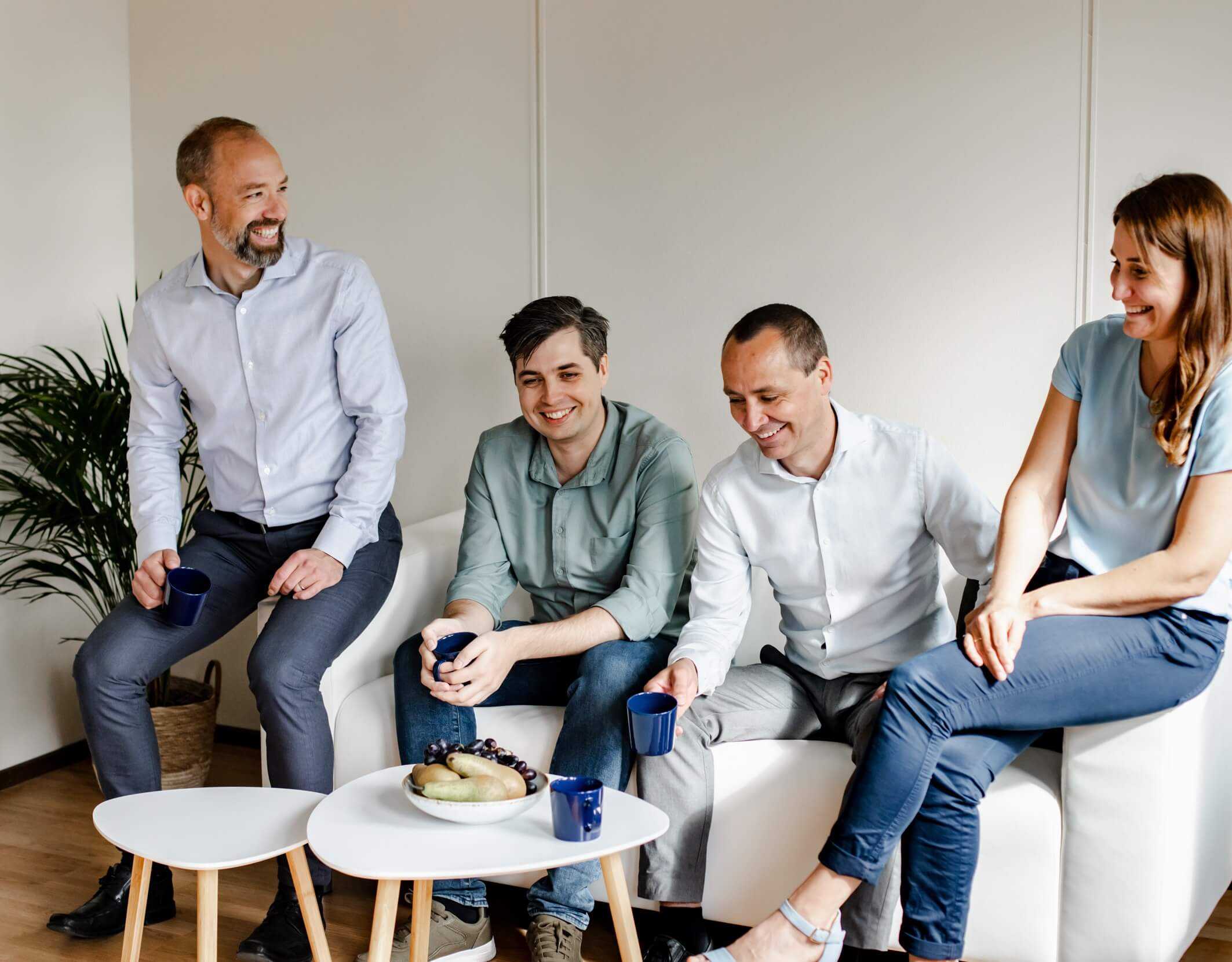 Indevit employees sitting in a sofa